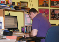 Photo of Chris working at the computer